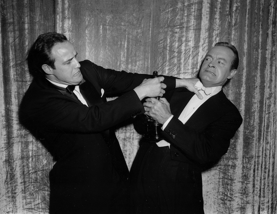 Actor Marlon Brando defends his statuette in a mock tussle with comedian Bob Hope, during the 27th annual Academy Awards show at Pantages Theater in Hollywood, Calif., March 30, 1955. Brando won best actor for his performance in "On the Waterfront." (AP Photo)